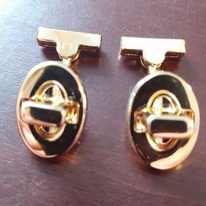 COACH gold tone lock style cufflinks